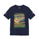 Rep the legendary North Carolina spirit with the "First in Flight" Race City Tee. Celebrating the fusion of aviation history and high-speed culture, this Flight Operations graphic is built for those who value precision and legacy.