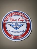 Rep your flight school wherever you land. Grab a Race City Flight Operations patch for your flight bag, backpack, or jacket. Only $2 at the front desk, or online!