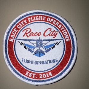 Rep your flight school wherever you land. Grab a Race City Flight Operations patch for your flight bag, backpack, or jacket. Only $2 at the front desk, or online!